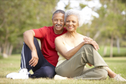 old couple sitting on the grass