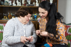 lady and old woman sewing